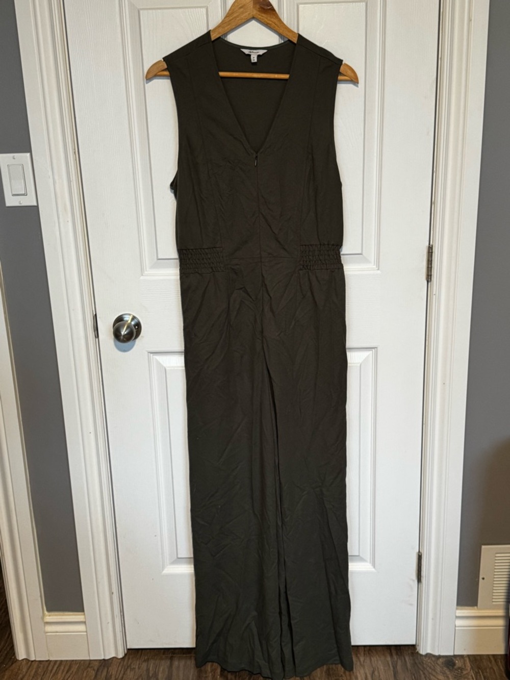 Reitman’s Olive V-Neck Wide Leg Jumpsuit with Smocked Waist and Zipper Closure